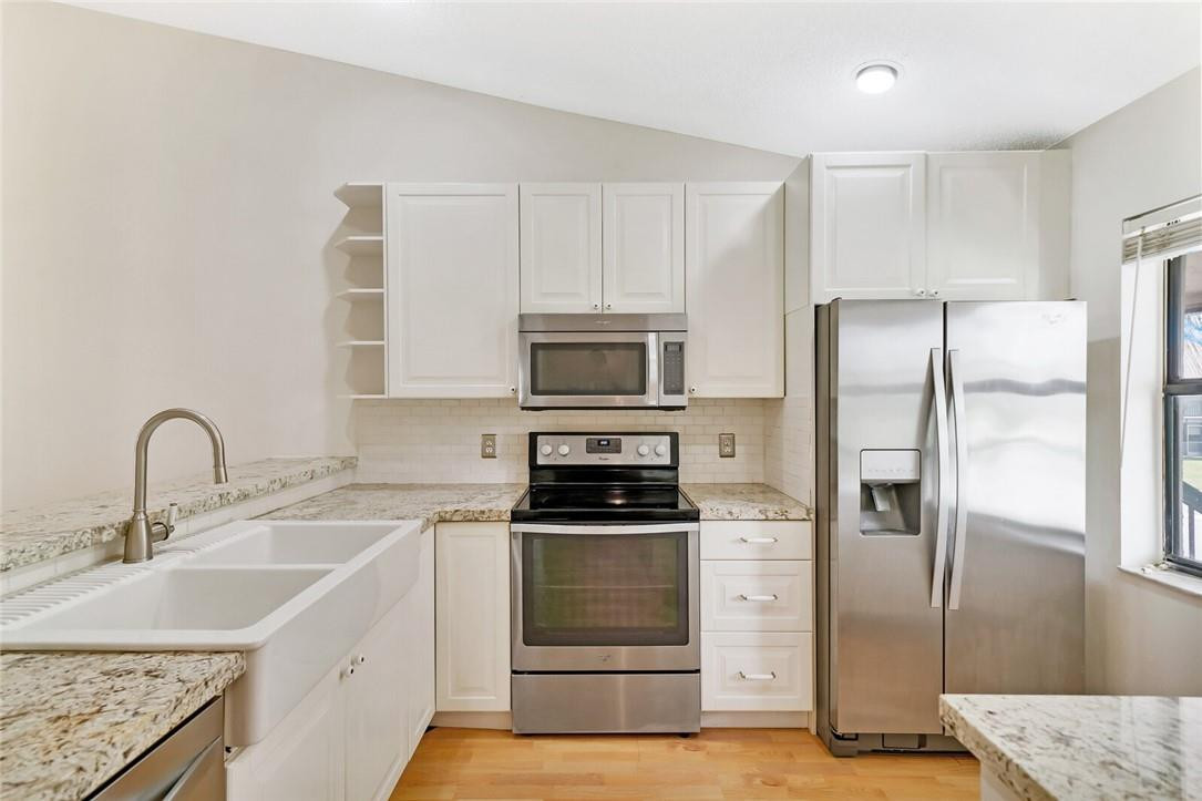 22088 Palms Way, Unit 201 Boca Raton, FL 33433 - Photo 1 of 22 RENOVATED KITCHEN WITH NEWER APPLIANCES
