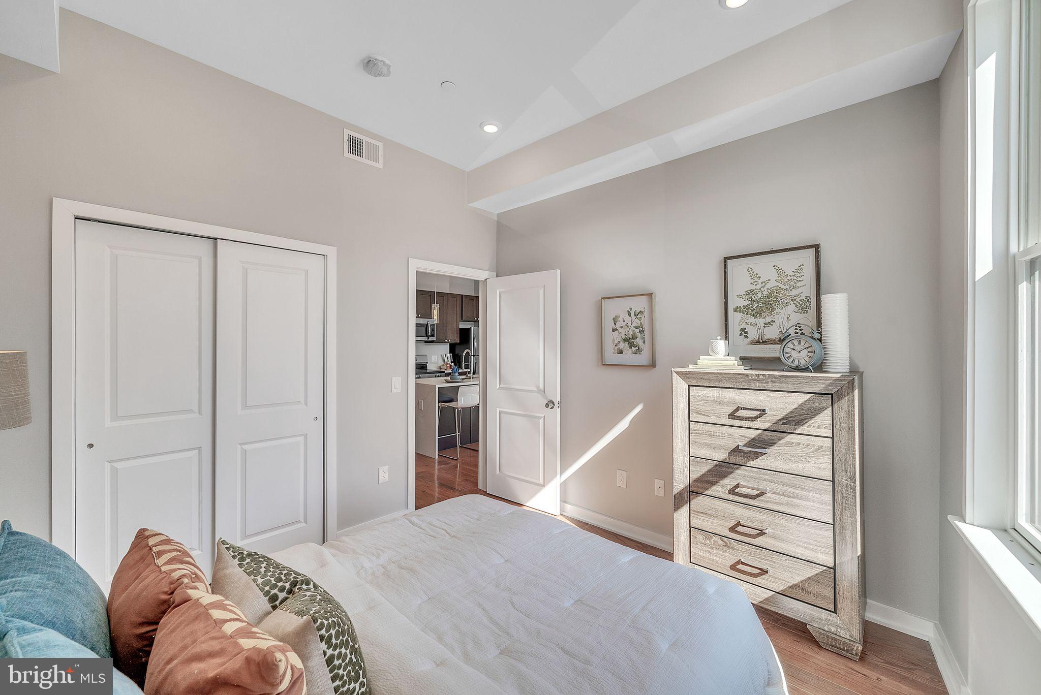 100 Forrest Avenue, Unit 204 Narberth, PA 19072 - Photo 11 of 17 a bedroom with a bed and a window