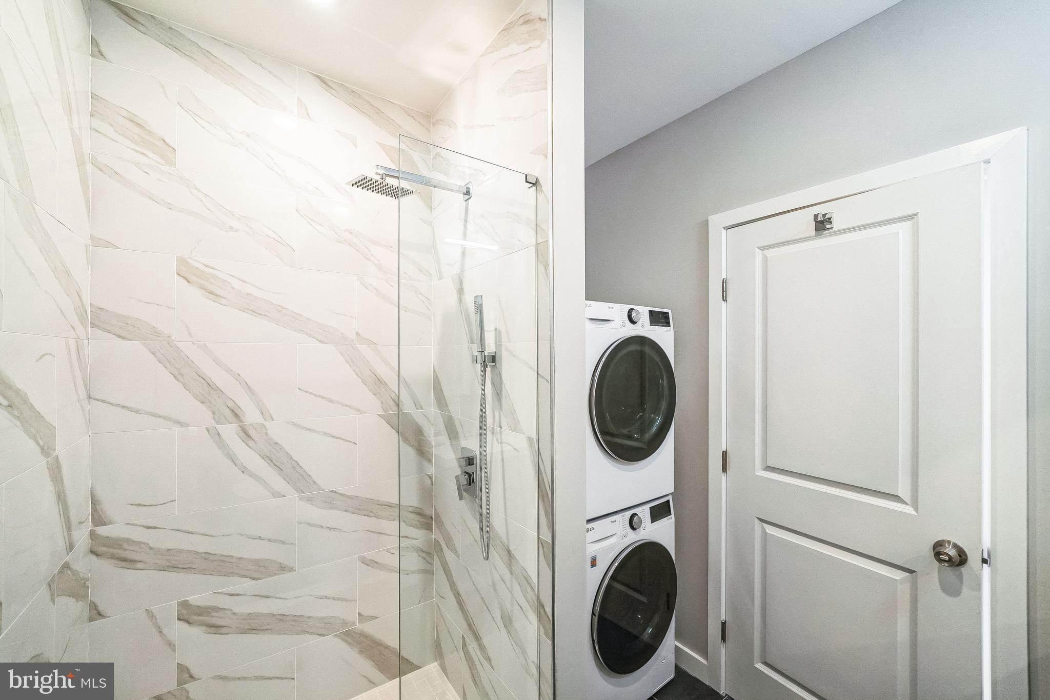 100 Forrest Avenue, Unit 204 Narberth, PA 19072 - Photo 14 of 17 a view of a hallway with washer and dryer