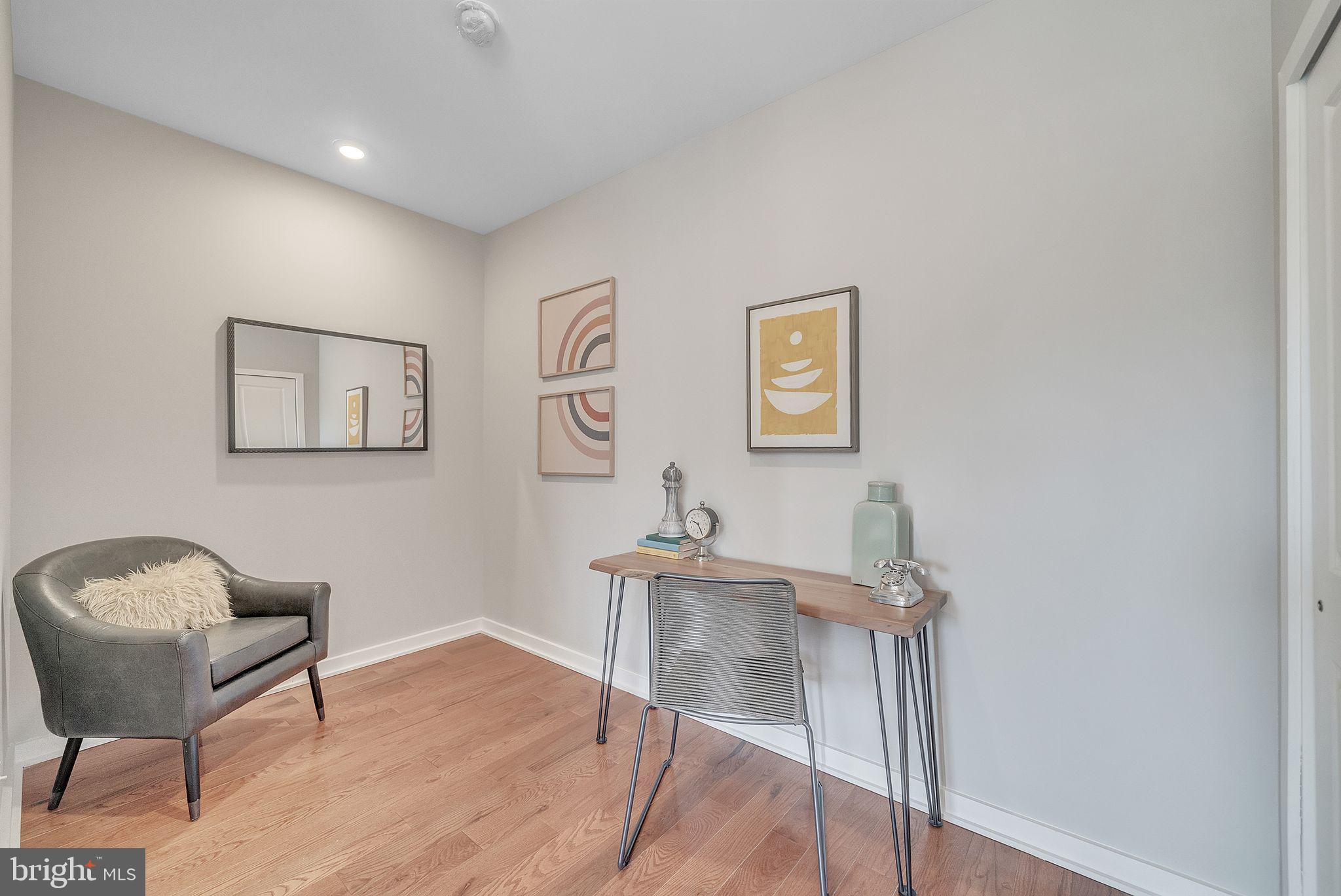 100 Forrest Avenue, Unit 204 Narberth, PA 19072 - Photo 10 of 17 a workspace with furniture and wooden floor