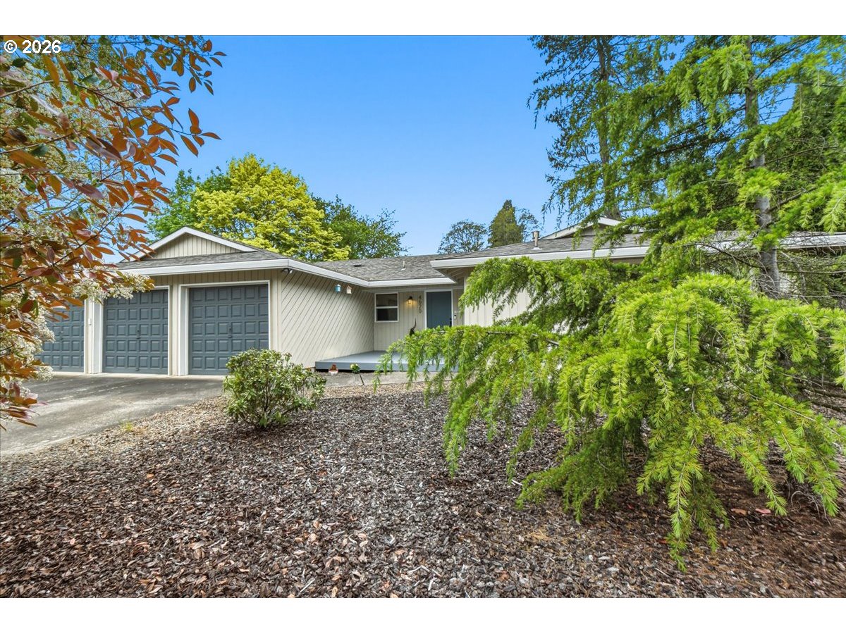 4620 Southwest 183rd Court Beaverton, OR 97078 - Photo 1 of 34 a house that has a tree in front of it