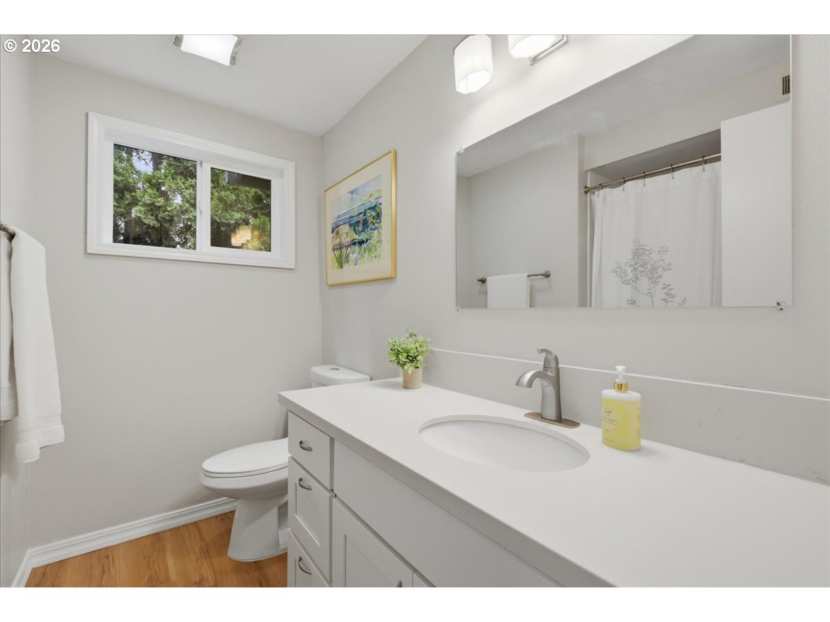 4620 Southwest 183rd Court Beaverton, OR 97078 - Photo 18 of 34 a bathroom with a sink a toilet and mirror