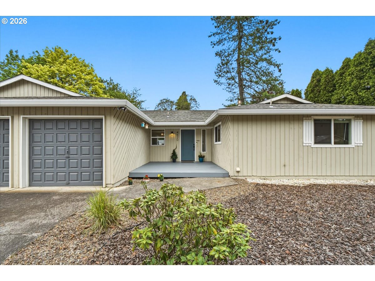 4620 Southwest 183rd Court Beaverton, OR 97078 - Photo 2 of 34 a front view of a house with garden