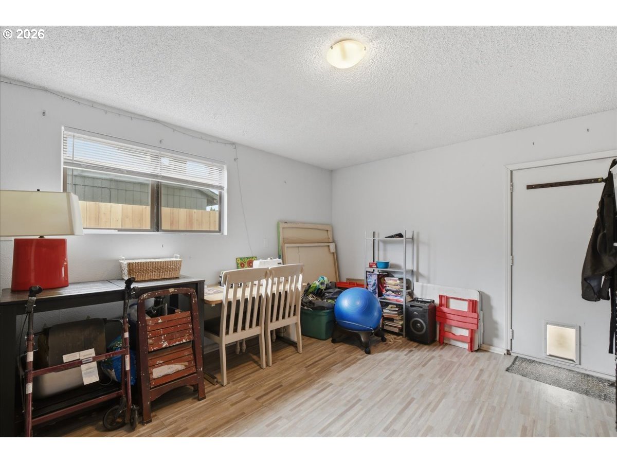 4620 Southwest 183rd Court Beaverton, OR 97078 - Photo 22 of 34 a bedroom with furniture and wooden floor