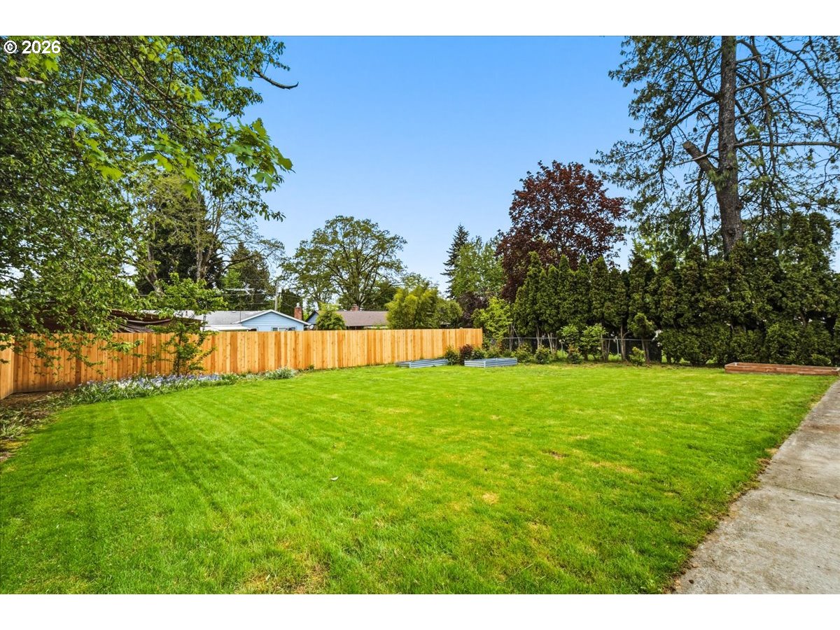 4620 Southwest 183rd Court Beaverton, OR 97078 - Photo 25 of 34 a view of yard with swimming pool and green space