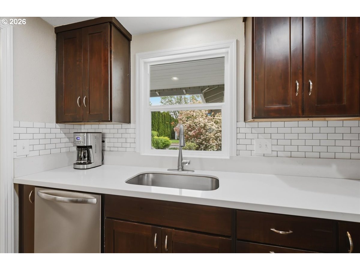 4620 Southwest 183rd Court Beaverton, OR 97078 - Photo 9 of 34 a bathroom with a sink and a mirror