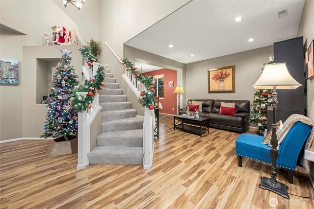 a living room with furniture and a potted plant