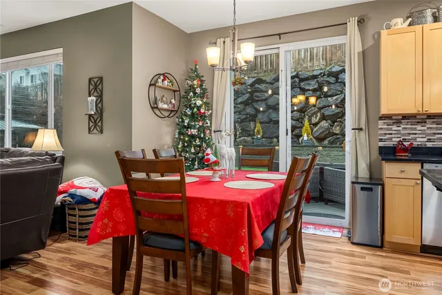 a view of a dining room with furniture window and wooden floor