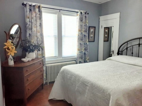 192 Thompson Road Webster, MA 01570 - Photo 12 of 32 a bedroom with a bed and a chandelier