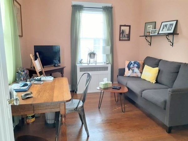192 Thompson Road Webster, MA 01570 - Photo 16 of 32 a living room with furniture and a flat screen tv