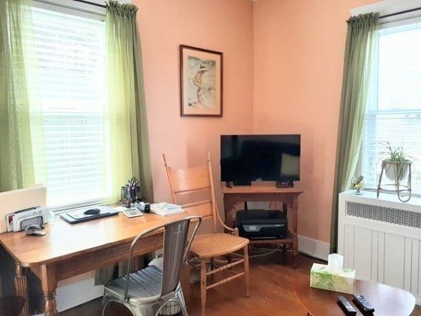 192 Thompson Road Webster, MA 01570 - Photo 17 of 32 a living room with furniture a flat screen tv and a fireplace