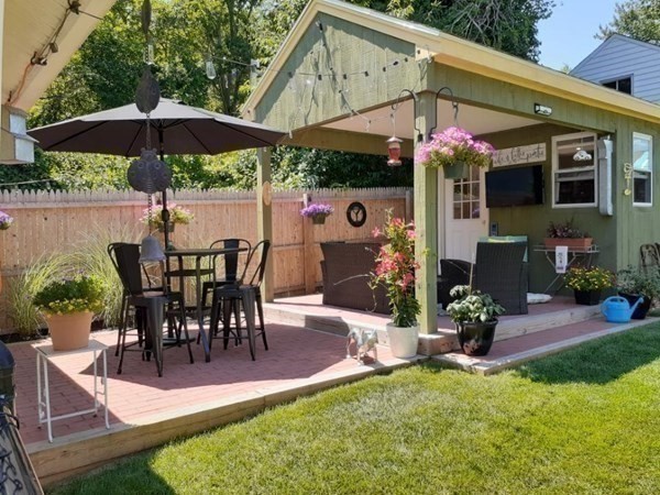 192 Thompson Road Webster, MA 01570 - Photo 2 of 32 a view of a patio with table and chairs under an umbrella
