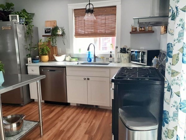 192 Thompson Road Webster, MA 01570 - Photo 3 of 32 a kitchen with stainless steel appliances granite countertop a stove a sink and a refrigerator