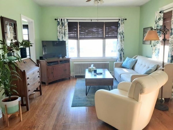192 Thompson Road Webster, MA 01570 - Photo 9 of 32 a living room with furniture and a flat screen tv
