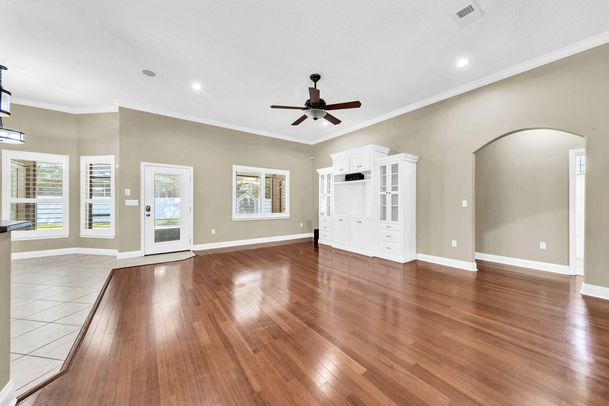 2623 Brodie Lane Crestview, FL 32536 - Photo 2 of 41 a view of an empty room with a window and wooden floor