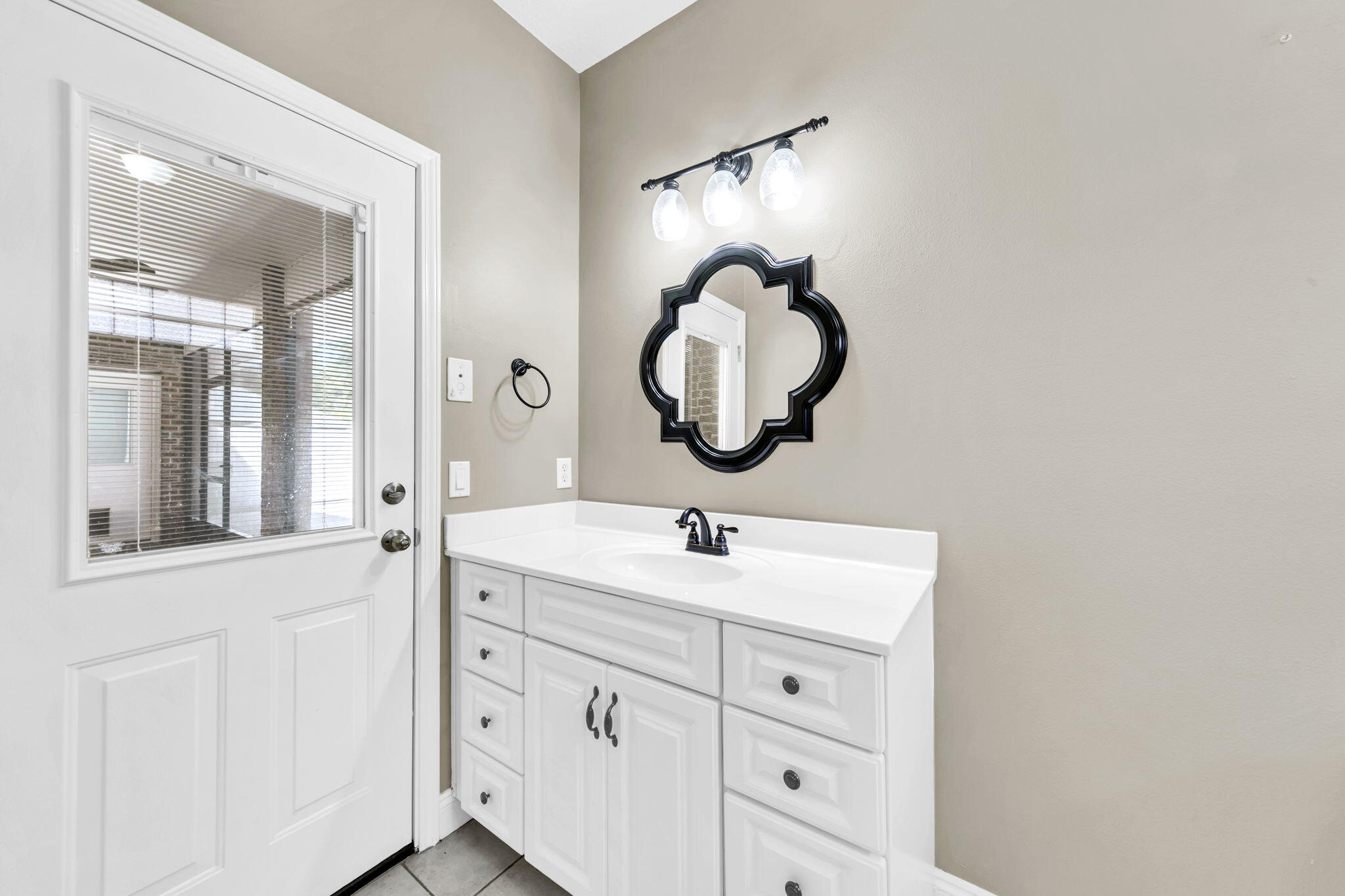 2623 Brodie Lane Crestview, FL 32536 - Photo 26 of 41 a bathroom with a double vanity sink and a mirror