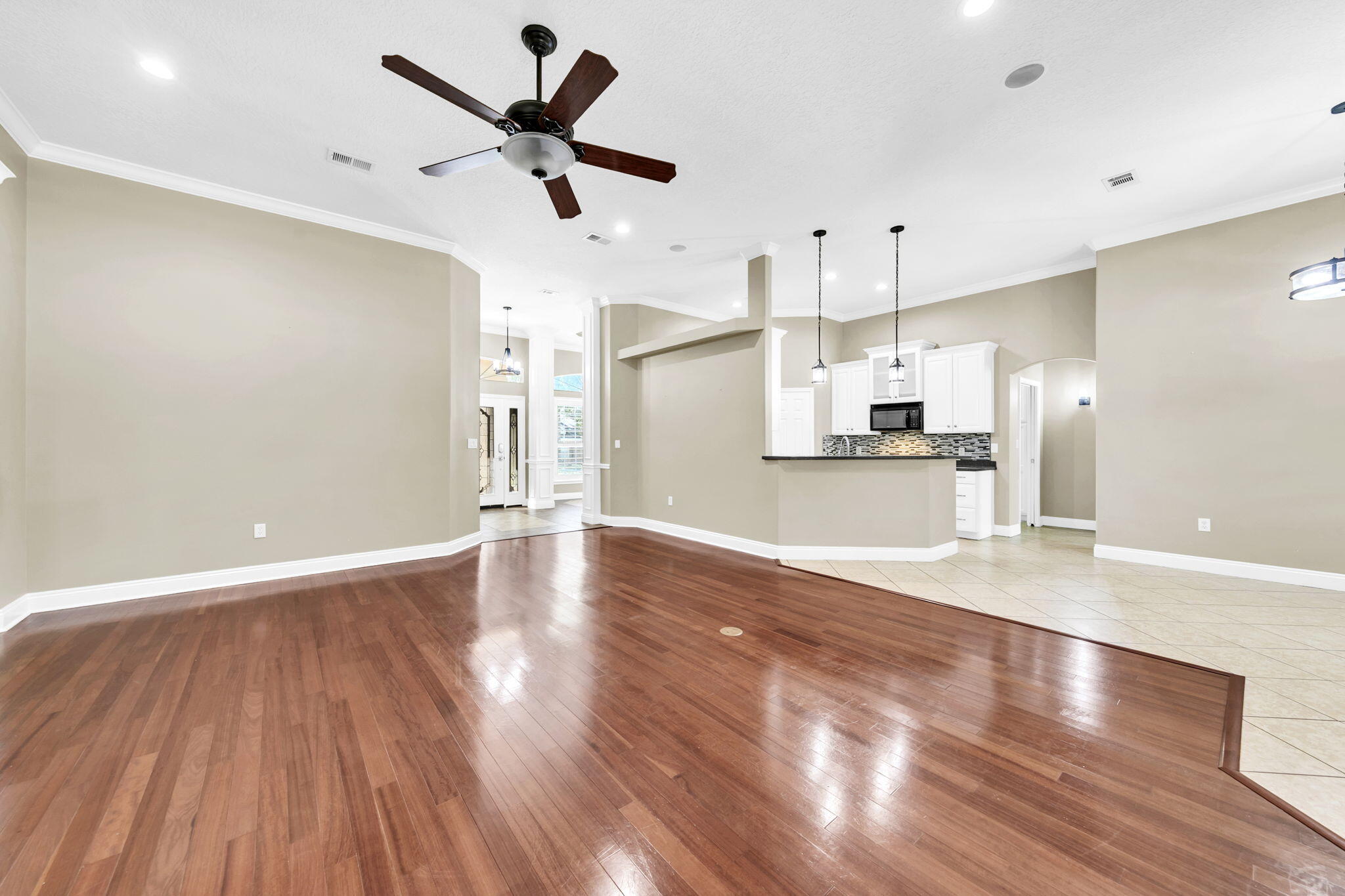 2623 Brodie Lane Crestview, FL 32536 - Photo 4 of 41 a view of a kitchen with stove and wooden floor