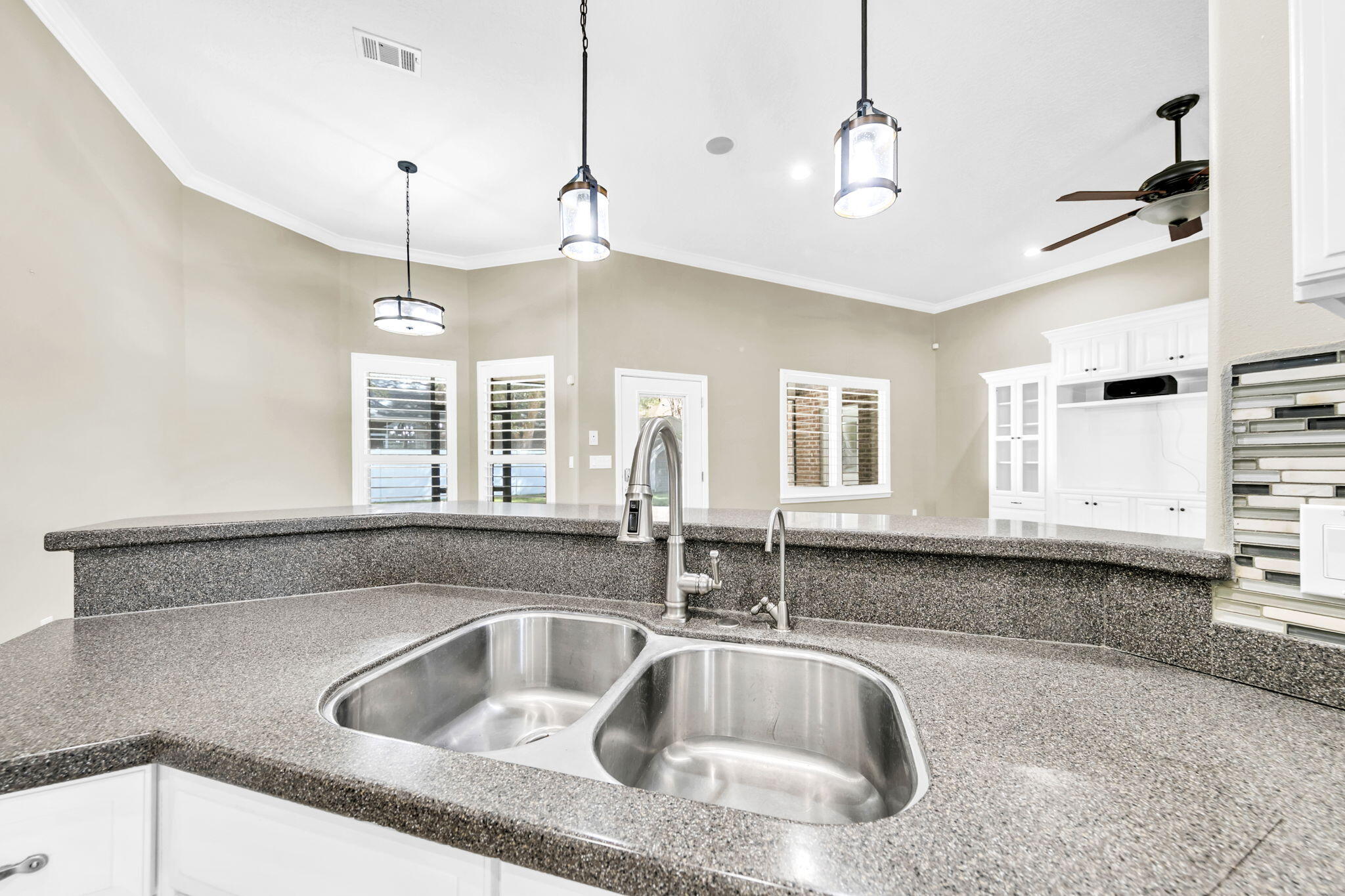 2623 Brodie Lane Crestview, FL 32536 - Photo 8 of 41 a kitchen with granite countertop a sink and a counter top space
