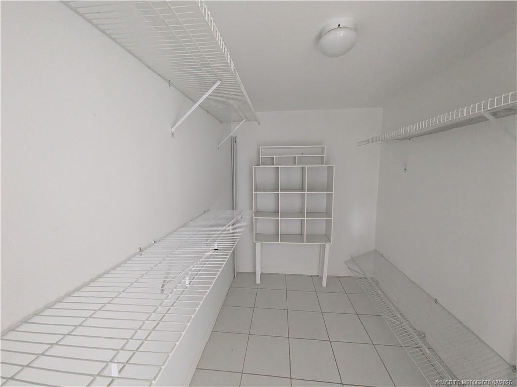 3100 Southeast Pruitt Road, Unit B301 Port St. Lucie, FL 34952 - Photo 14 of 40 Roomy walk-in closet from vanity area.