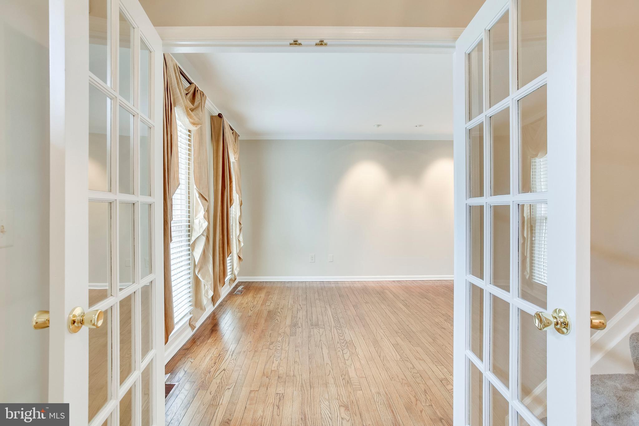 122 Hamilton Road Sterling, VA 20165 - Photo 7 of 37 French doors into large living room