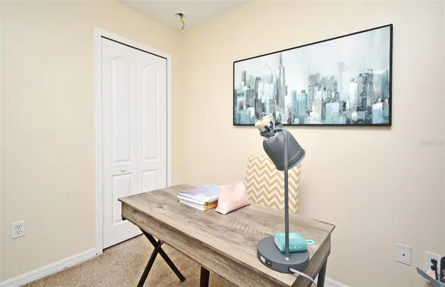 a view of a workspace with furniture