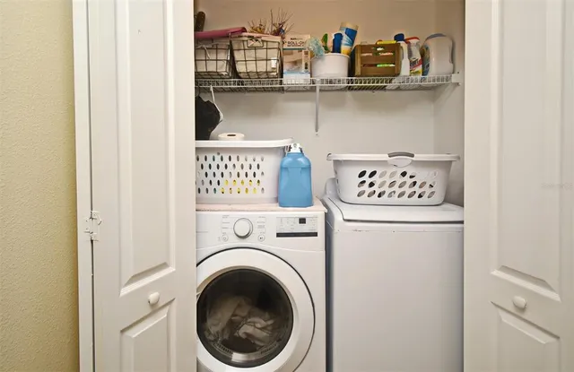 a utility room with dryer and washer