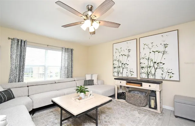 a living room with furniture and window