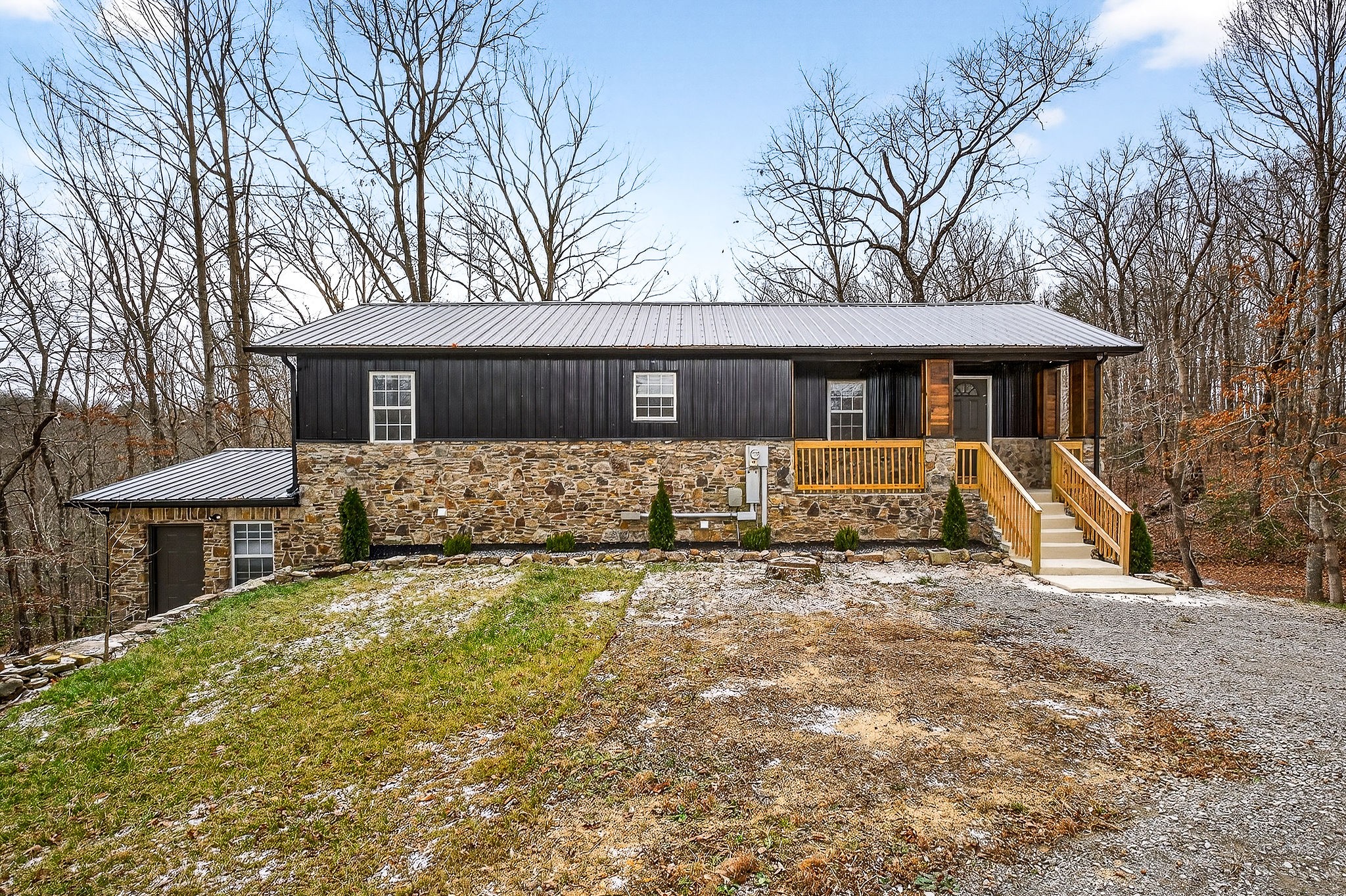 9388 Harrison Ferry Road McMinnville, TN 37110 - Photo 12 of 54 a front view of a house with yard and glass windows