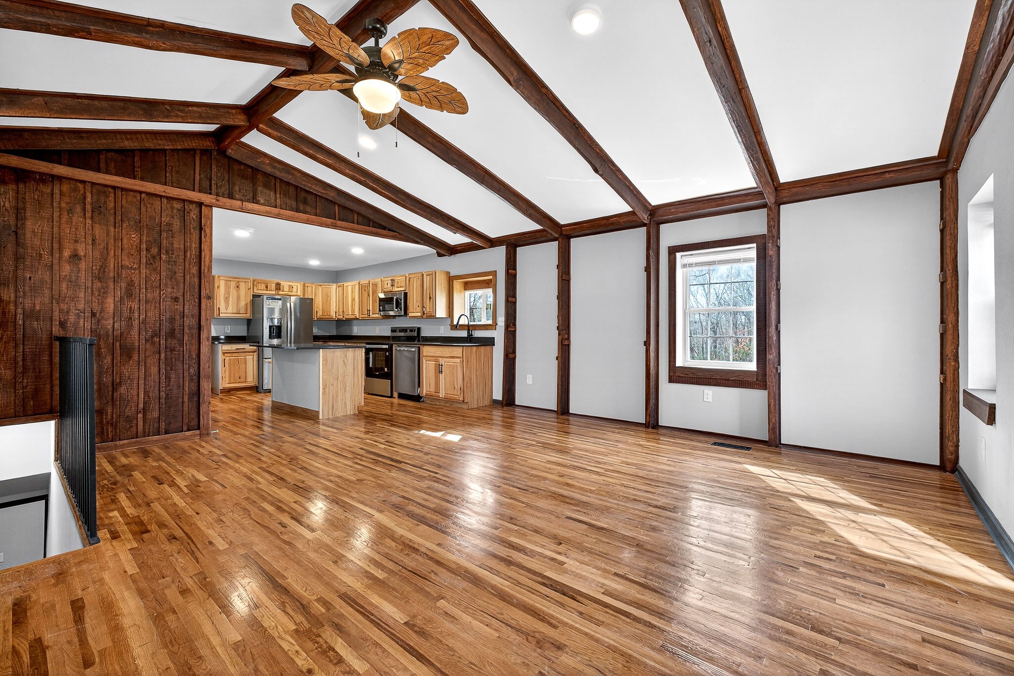9388 Harrison Ferry Road McMinnville, TN 37110 - Photo 18 of 54 a view of empty room with wooden floor and windows