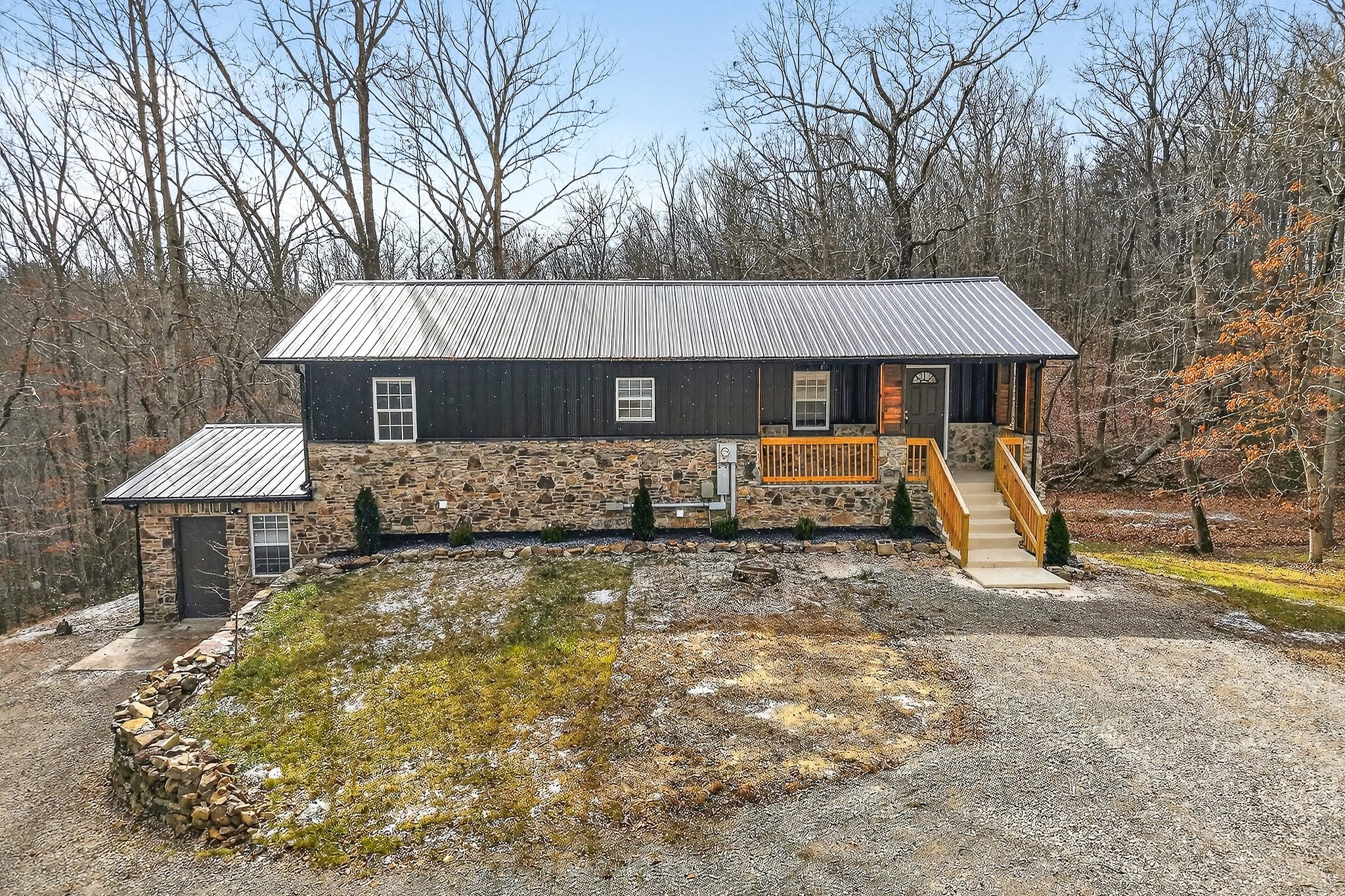 9388 Harrison Ferry Road McMinnville, TN 37110 - Photo 2 of 54 a front view of a house with garden