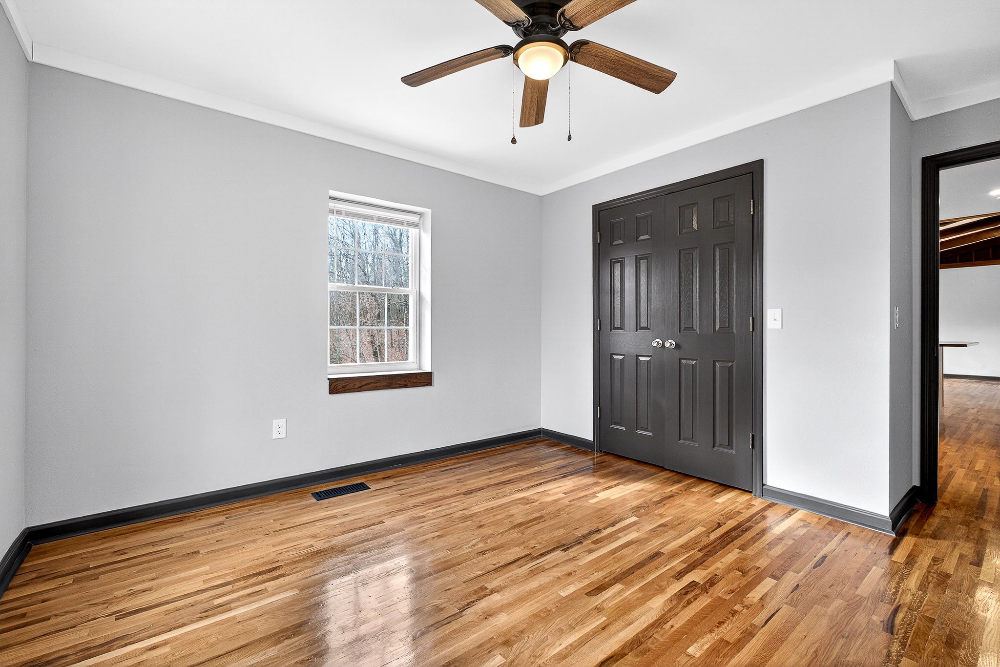 9388 Harrison Ferry Road McMinnville, TN 37110 - Photo 24 of 54 a view of an empty room with wooden floor and a window
