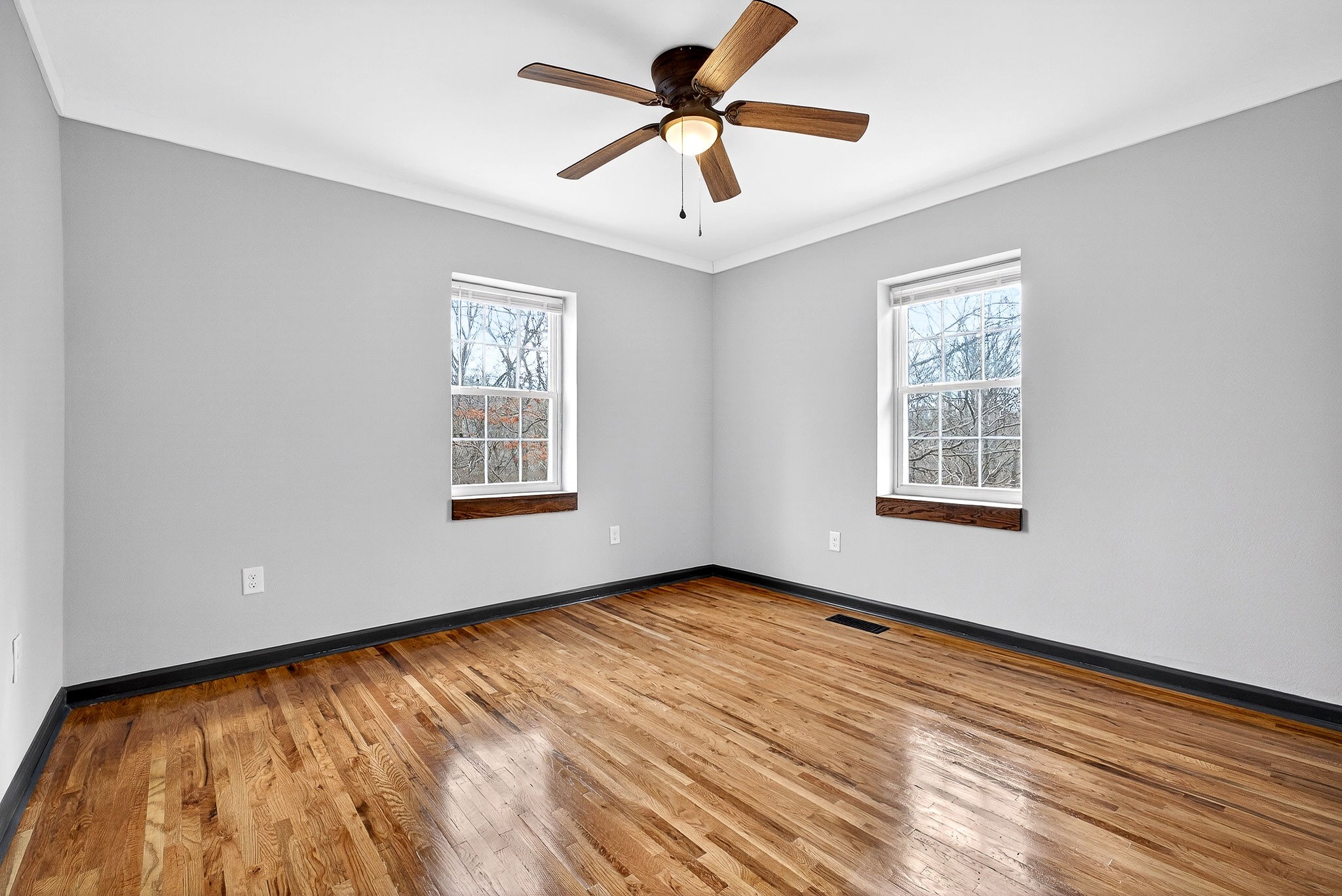 9388 Harrison Ferry Road McMinnville, TN 37110 - Photo 26 of 54 a view of an empty room with window and a chandelier fan