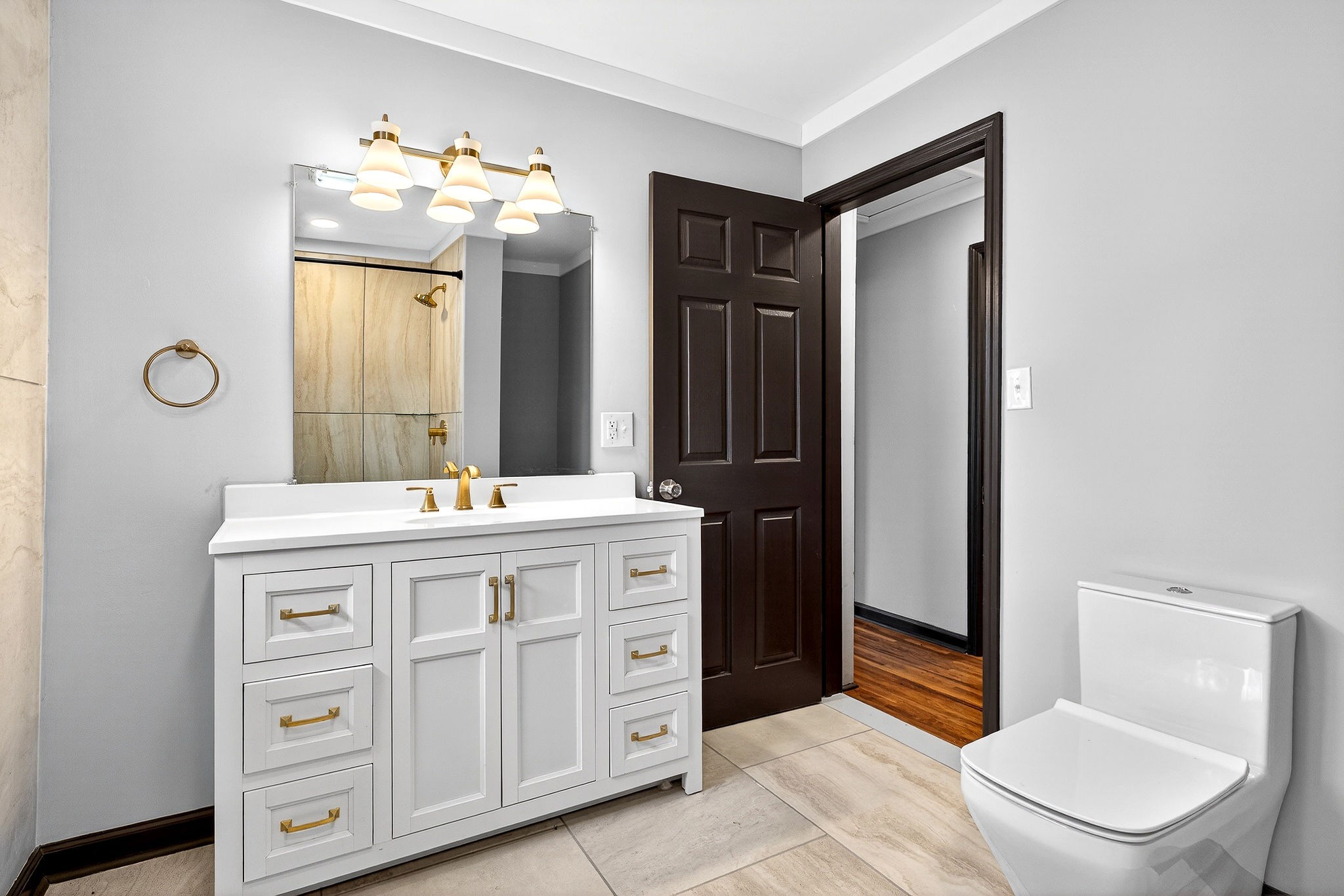 9388 Harrison Ferry Road McMinnville, TN 37110 - Photo 29 of 54 a spacious bathroom with a granite countertop sink a toilet and a mirror