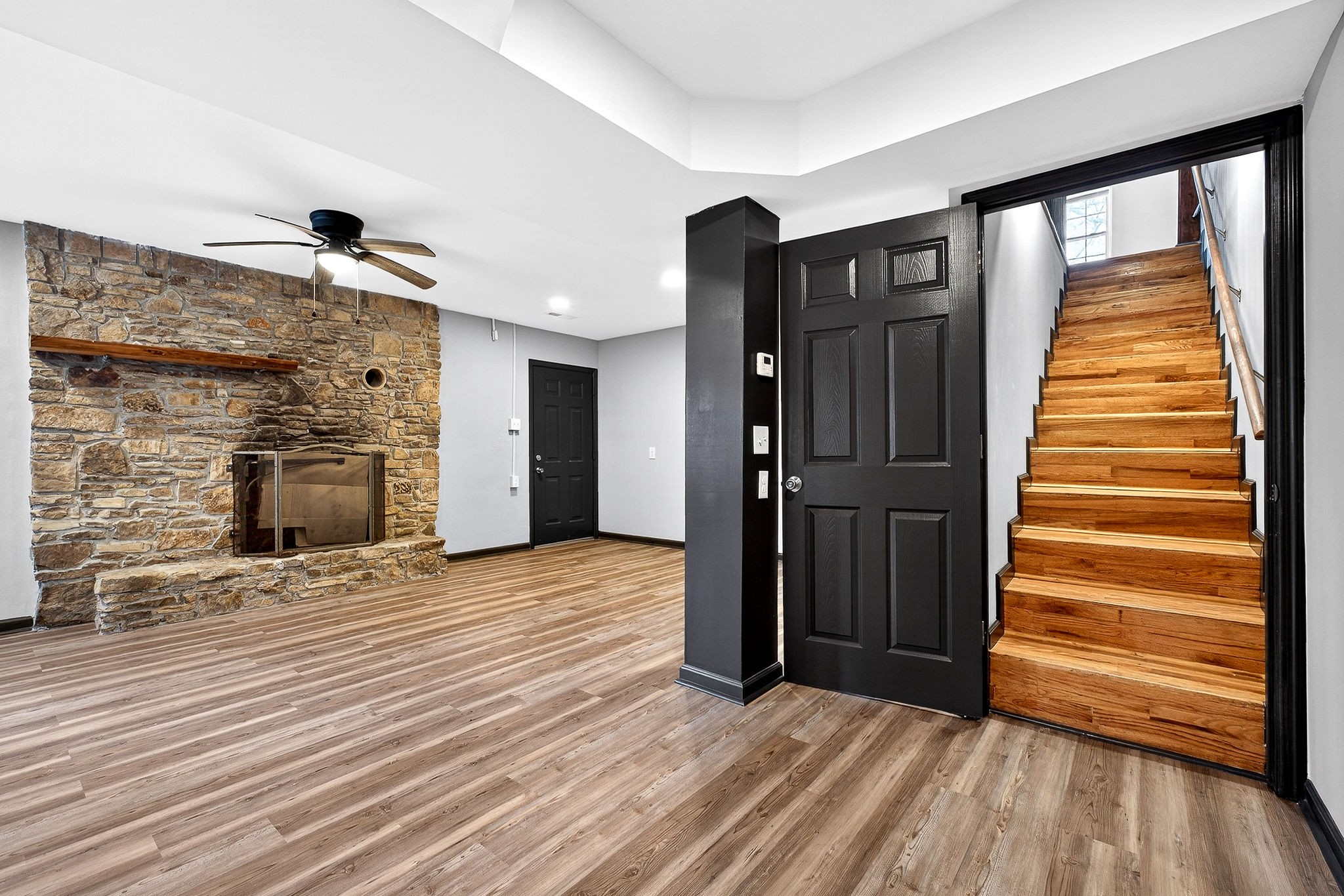 9388 Harrison Ferry Road McMinnville, TN 37110 - Photo 33 of 54 a view of a livingroom with wooden floor and stairs