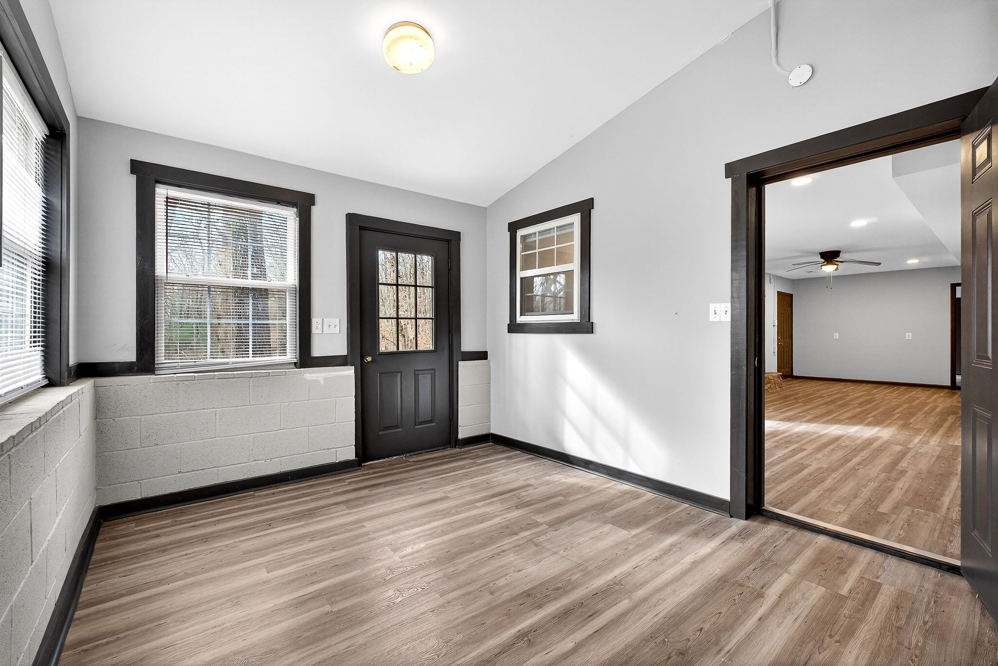 9388 Harrison Ferry Road McMinnville, TN 37110 - Photo 36 of 54 a view of an empty room with window and wooden floor