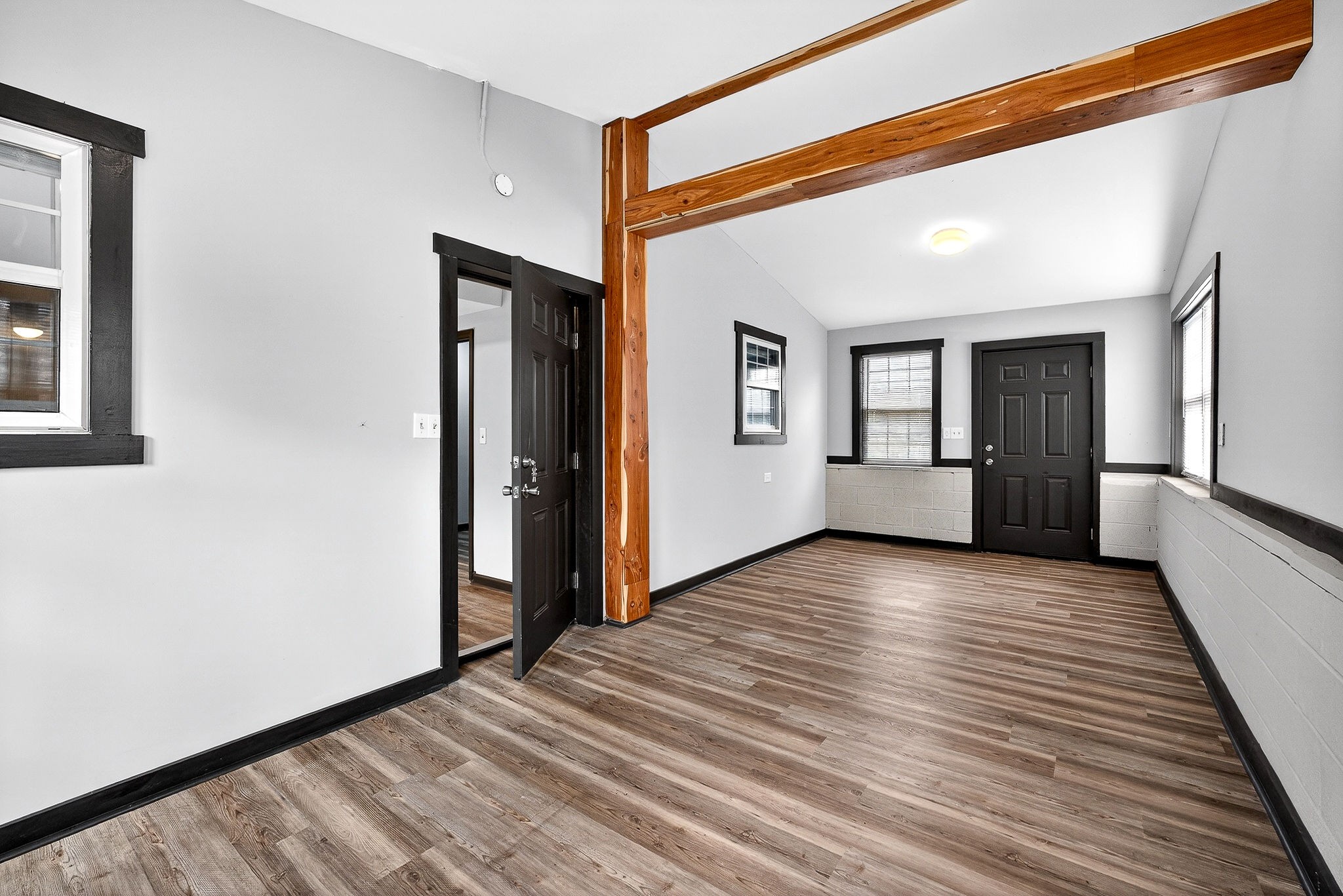 9388 Harrison Ferry Road McMinnville, TN 37110 - Photo 37 of 54 a view of an empty room with wooden floor and a window