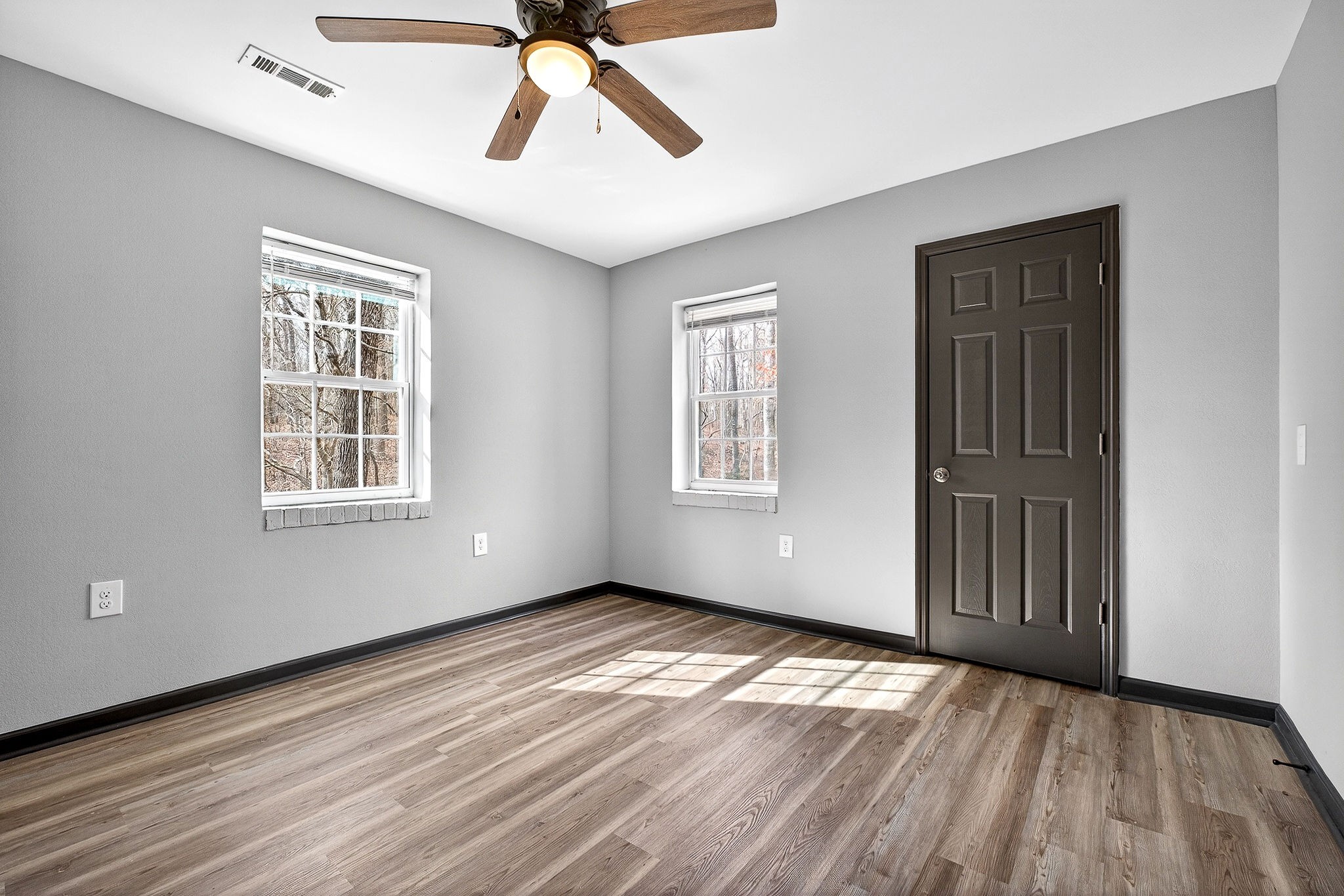 9388 Harrison Ferry Road McMinnville, TN 37110 - Photo 39 of 54 a view of empty room with wooden floor and fan
