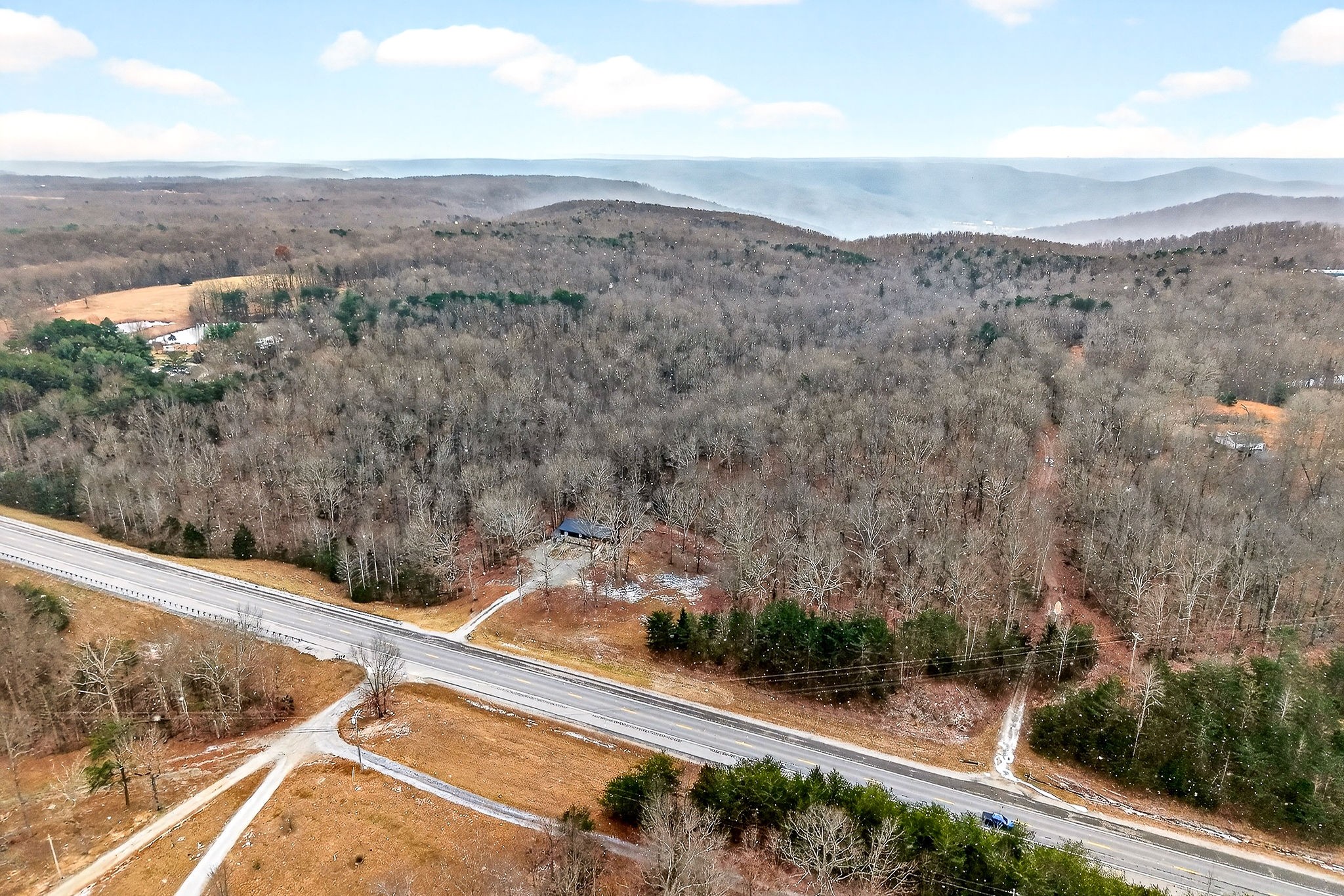 9388 Harrison Ferry Road McMinnville, TN 37110 - Photo 6 of 54 a view of a forest with mountain