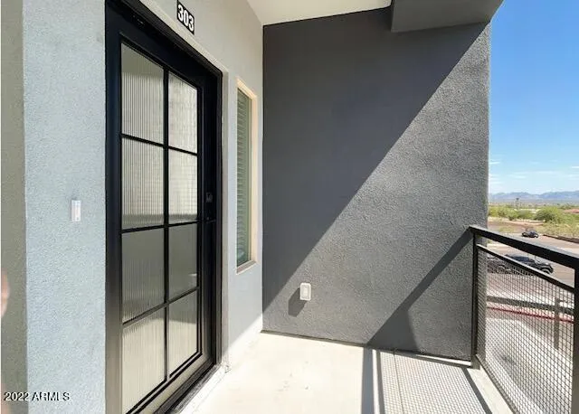a view of kitchen with wooden floor and a window