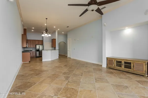 a view of a kitchen with a sink and a window