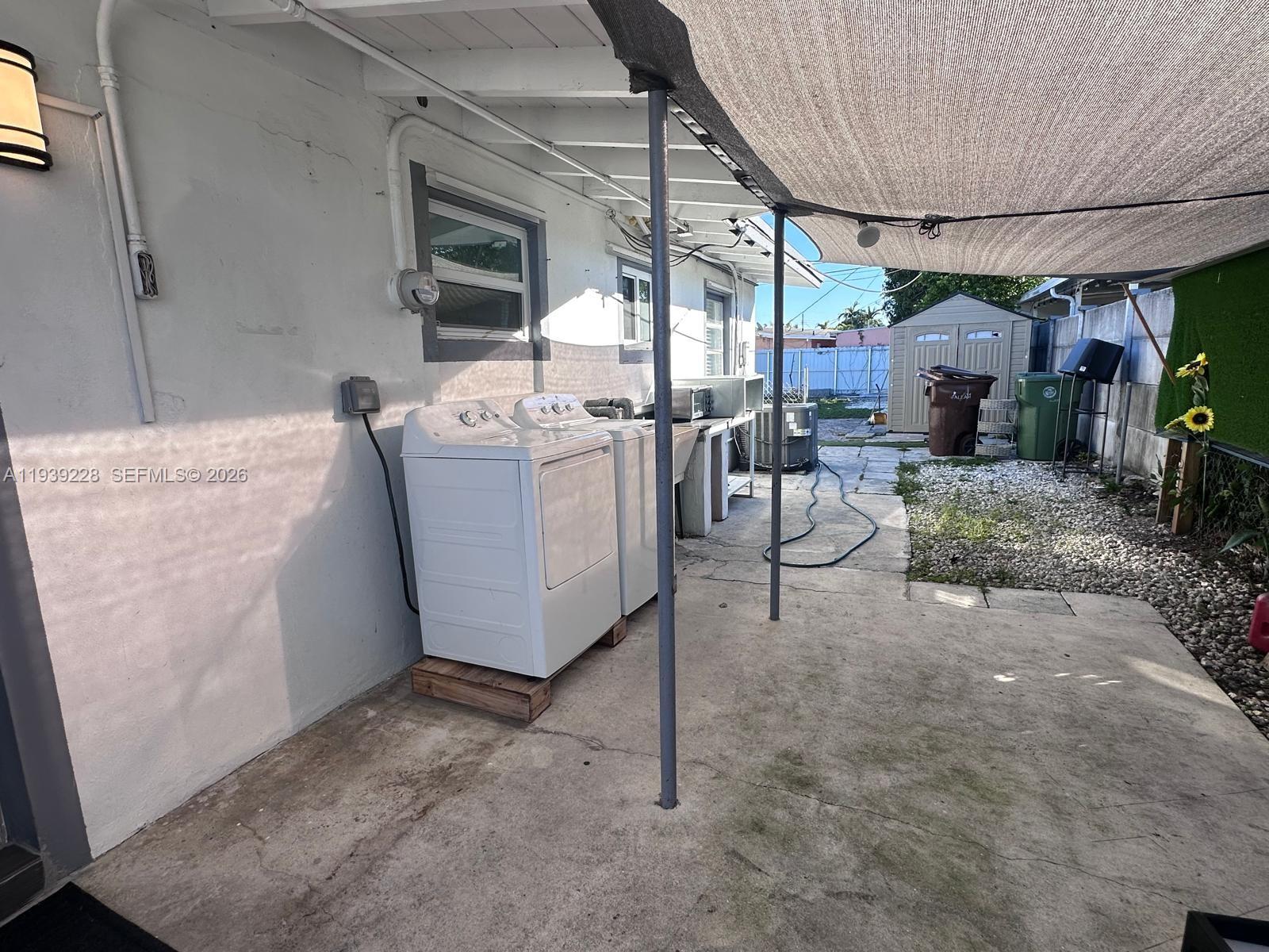 650 Southeast 1st Place Hialeah, FL 33010 - Photo 12 of 22 a room with furniture a flat screen tv and a fireplace