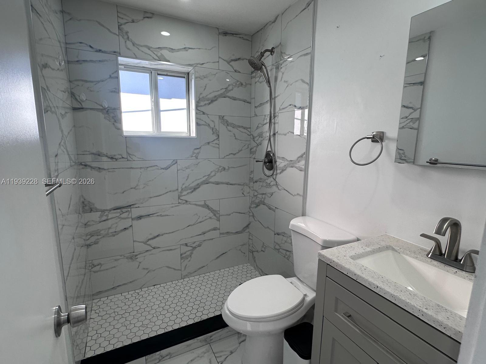 650 Southeast 1st Place Hialeah, FL 33010 - Photo 13 of 22 a bathroom with a sink toilet and shower