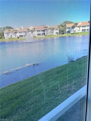 a view of a lake with a big yard