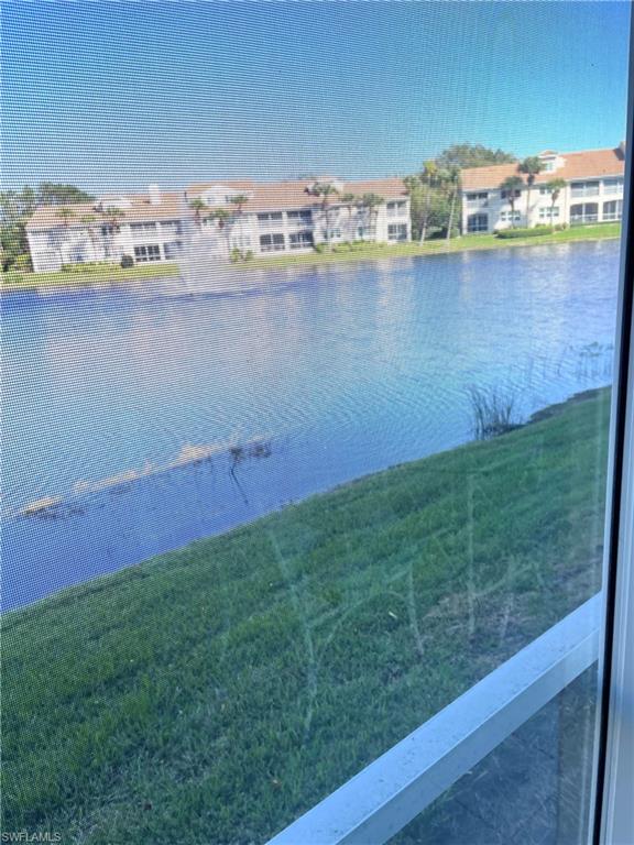 a view of a lake with a big yard