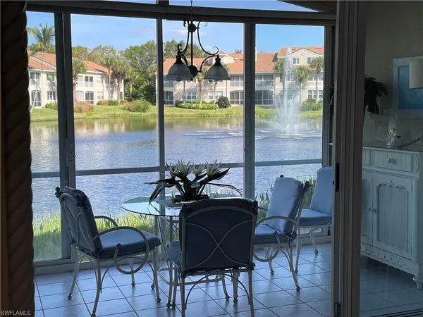 a view of a dining room with furniture window and outside view