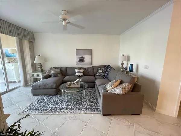 a living room with furniture and a rug