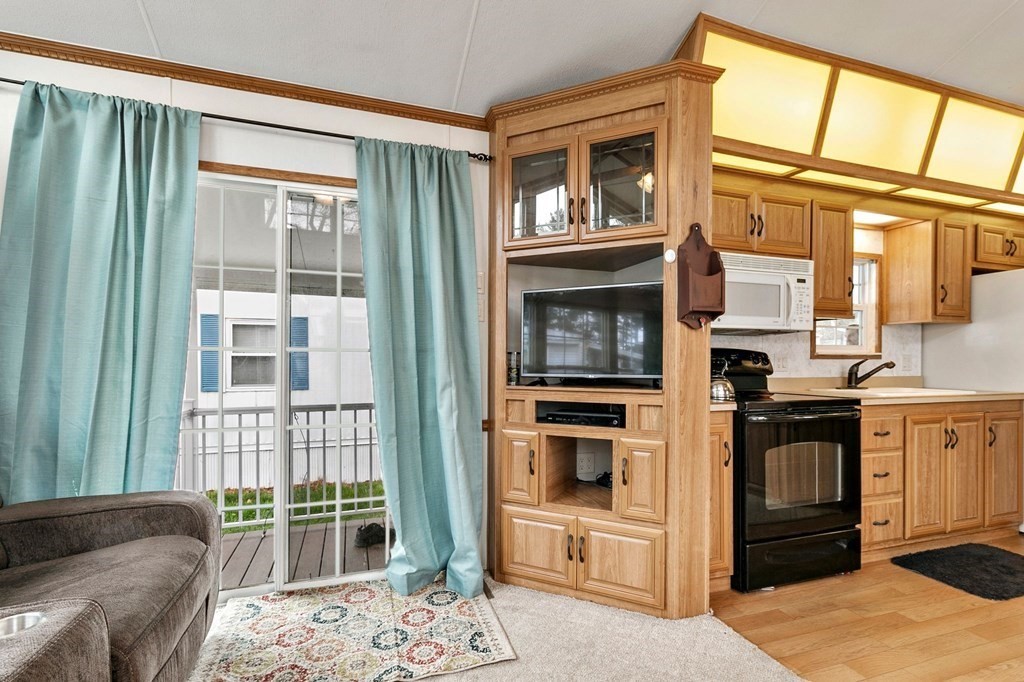 404 Southwick Road, Unit 9 Westfield, MA 01085 - Photo 13 of 30 a kitchen view with furniture and windows