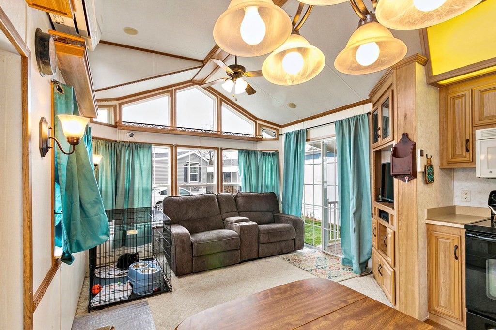 404 Southwick Road, Unit 9 Westfield, MA 01085 - Photo 17 of 30 a living room with furniture a fireplace and a large window