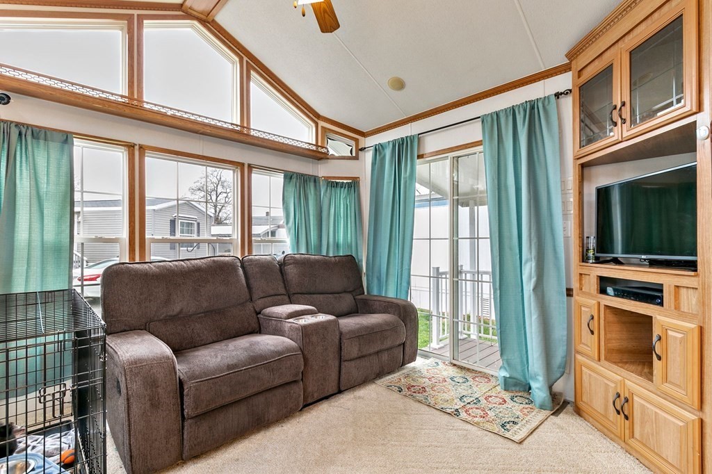 404 Southwick Road, Unit 9 Westfield, MA 01085 - Photo 18 of 30 a living room with furniture and a flat screen tv