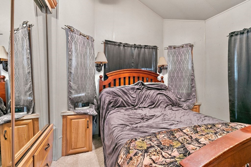 404 Southwick Road, Unit 9 Westfield, MA 01085 - Photo 22 of 30 a bedroom with a large bed and a window